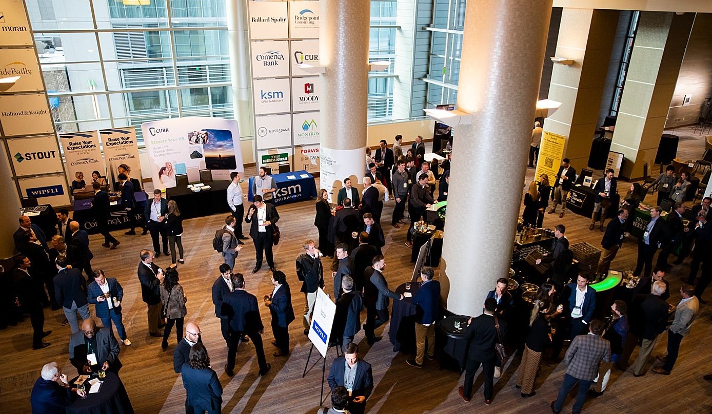 Many finance professionals in the event hallway 